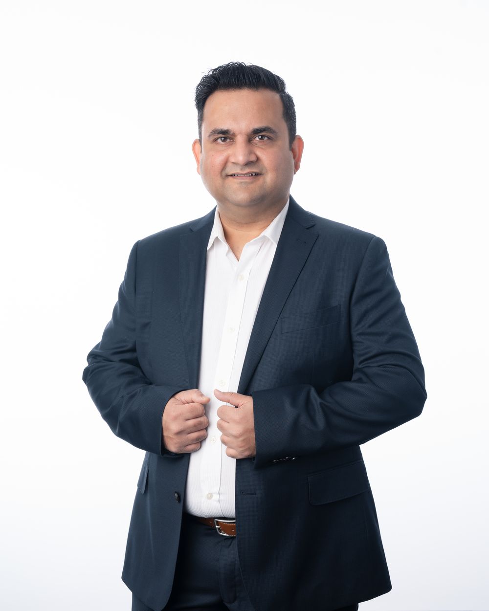 Jigar Modi in a navy suit